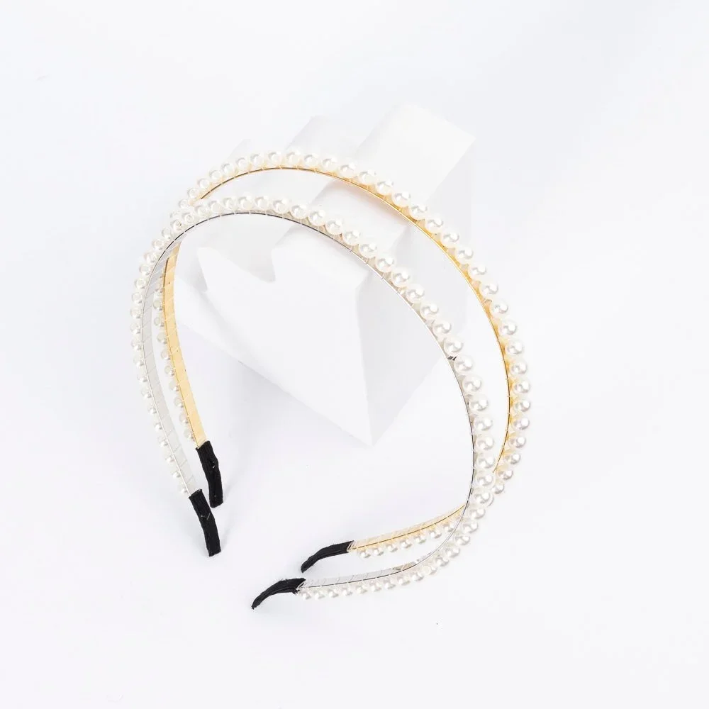 VINCHA CON PERLAS ENROSCADAS